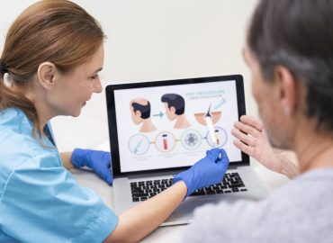 Man and woman undergoing GFC therapy for hair fall treatment at a modern hair clinic.